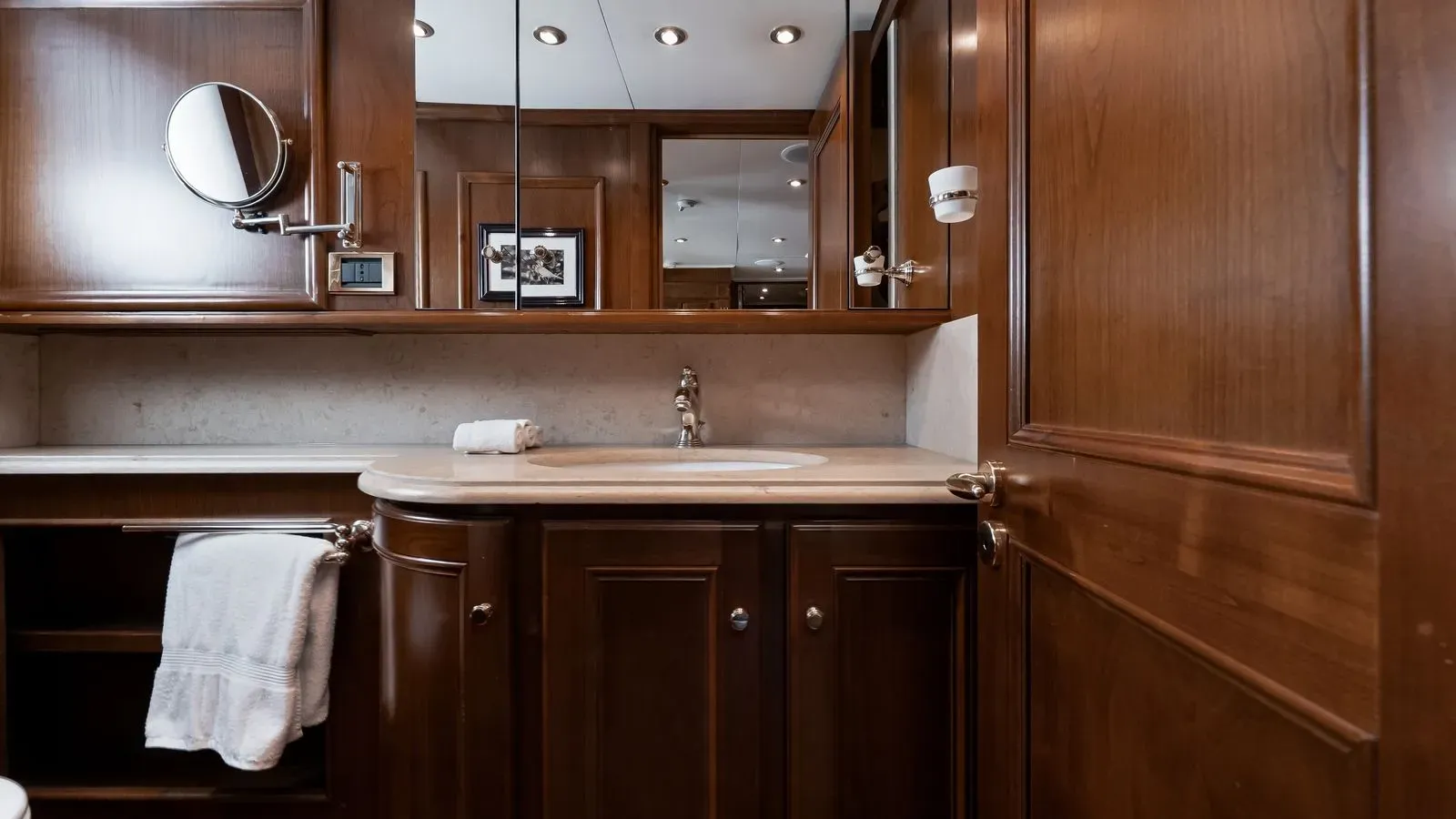 Guest bathroom vanity with wood cabinetry