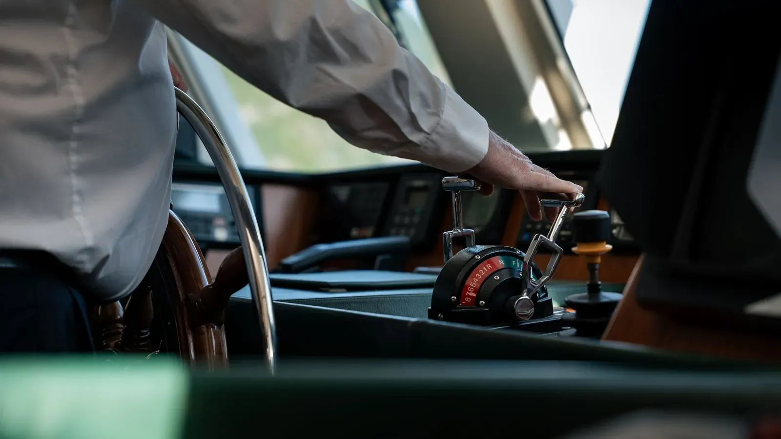 Captain’s hand on Chantal’s engine controls at the helm