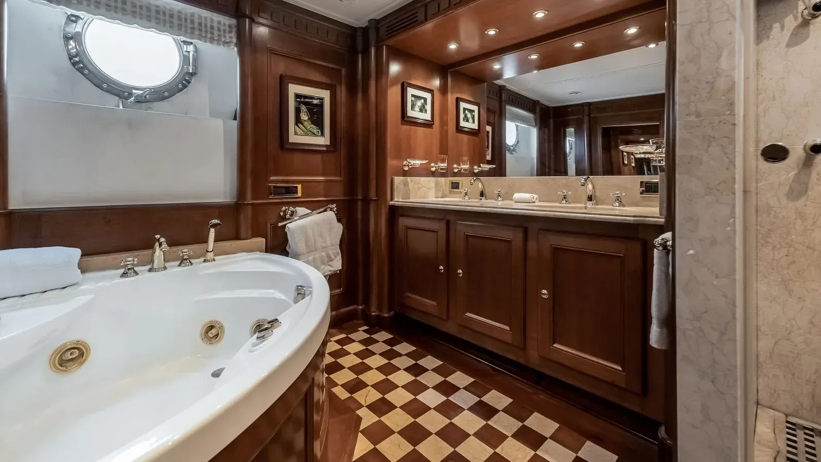 Owner’s suite bathroom with whirlpool bath and double vanity
