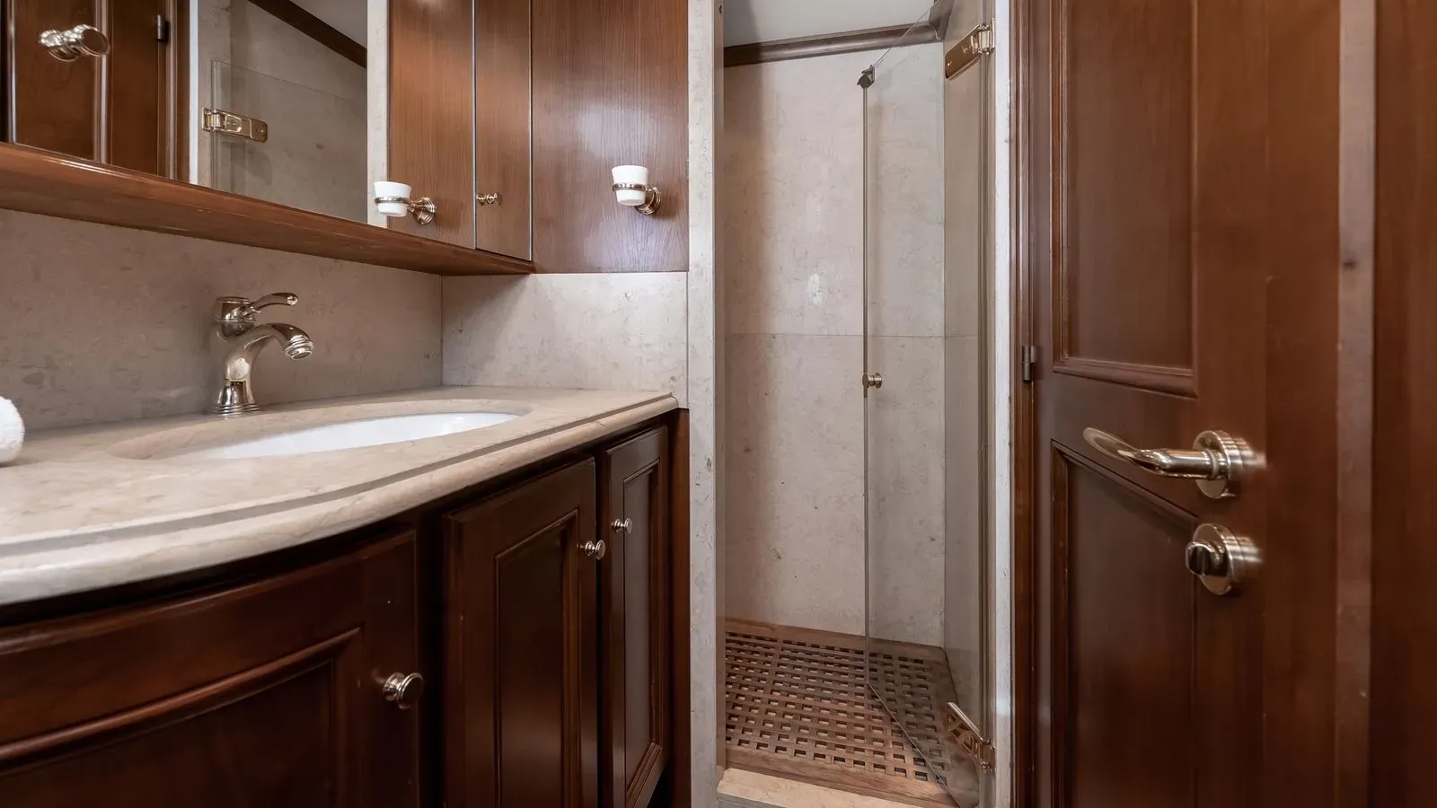 Guest en-suite bathroom with marble shower and vanity