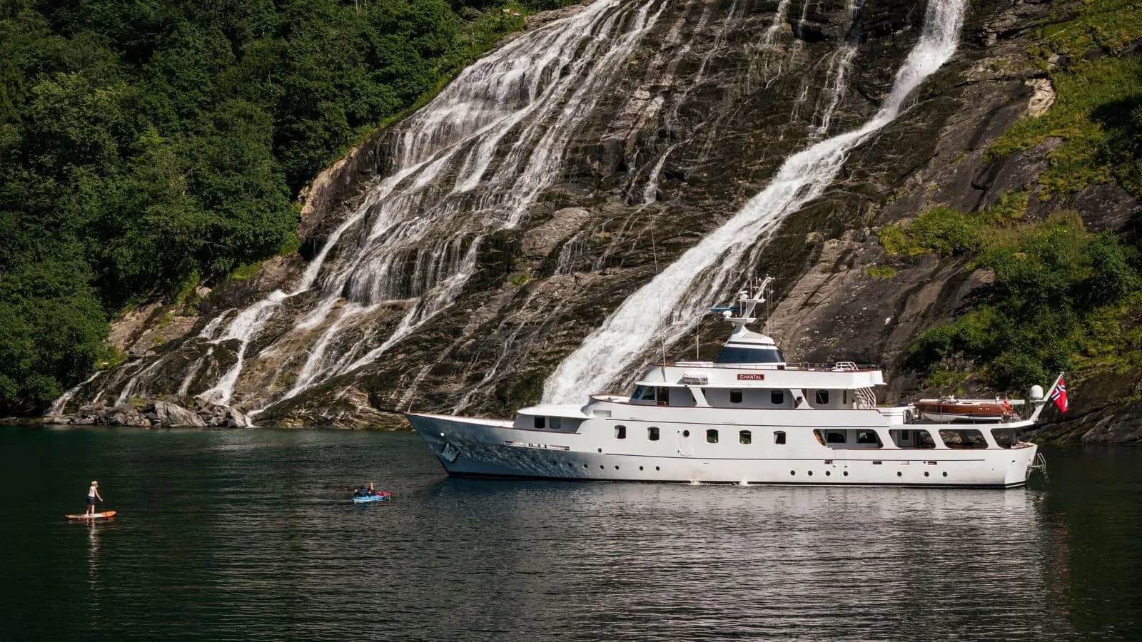 Chantal anchored beneath a fjord waterfall