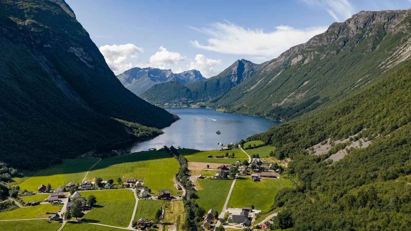 Aerial view across a Norwegian fjord and shoreline village