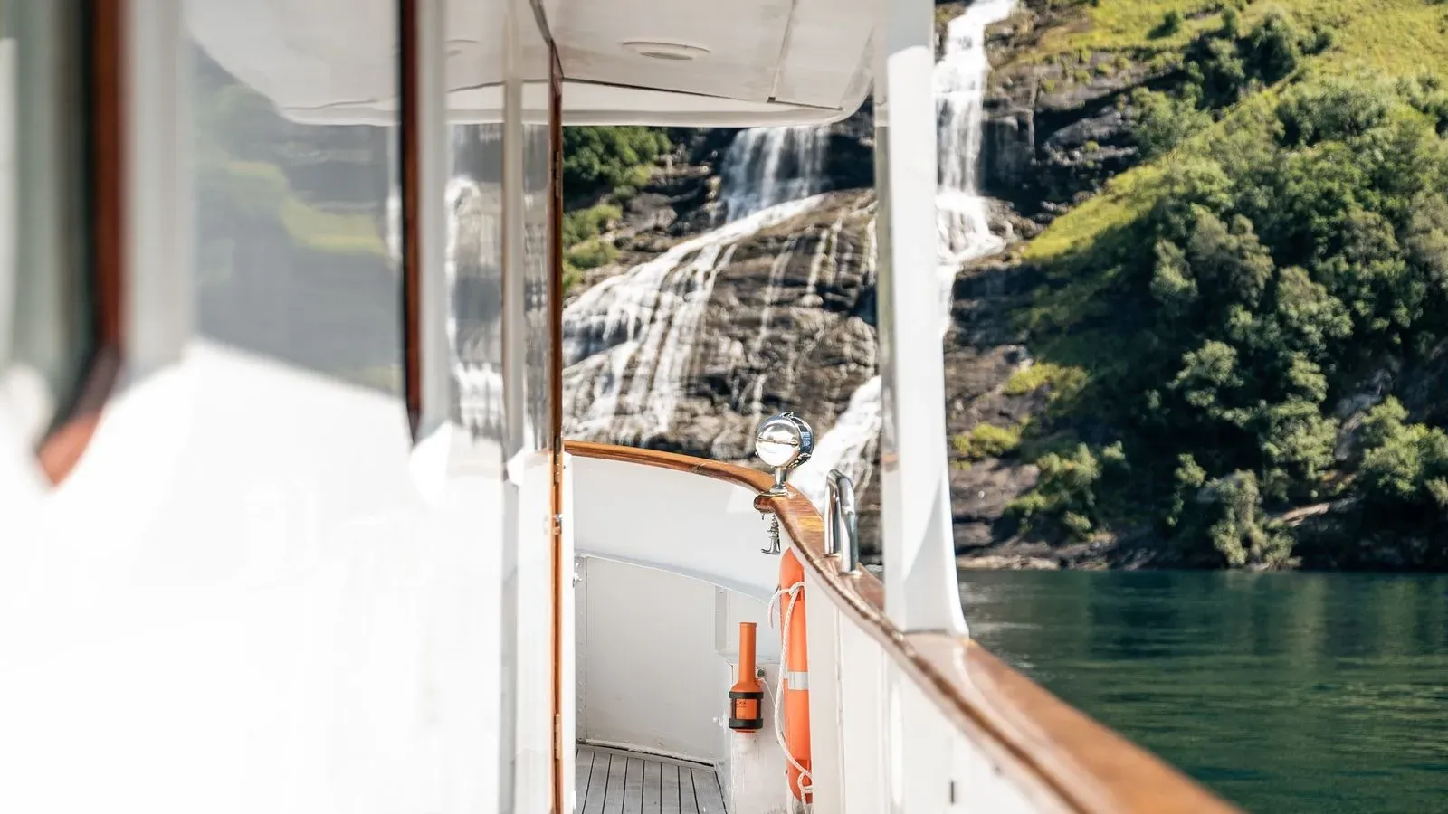 Covered side deck with a close-up waterfall view
