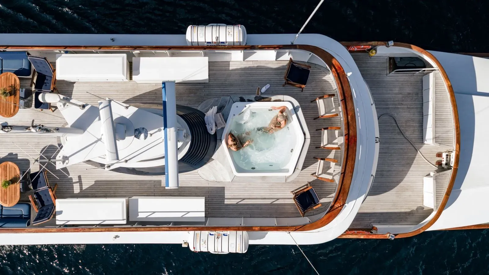 Two guests relaxing in Chantal’s jacuzzi, viewed from above