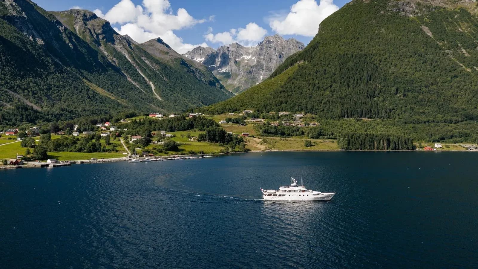 Chantal cruising through a mountain-framed Norwegian fjord
