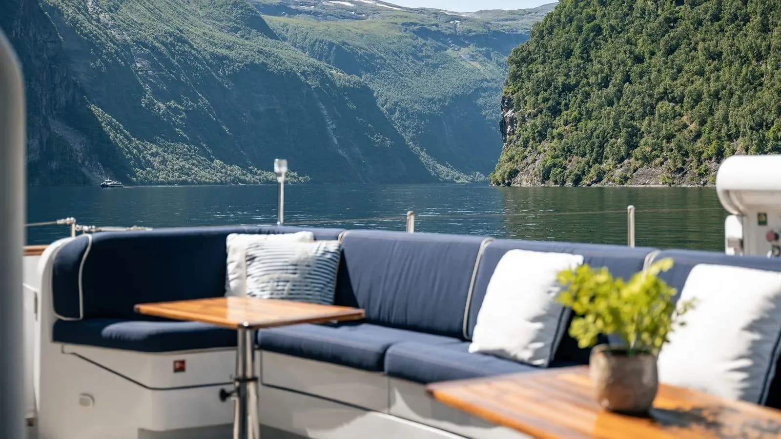 Curved outdoor seating with a panoramic fjord view
