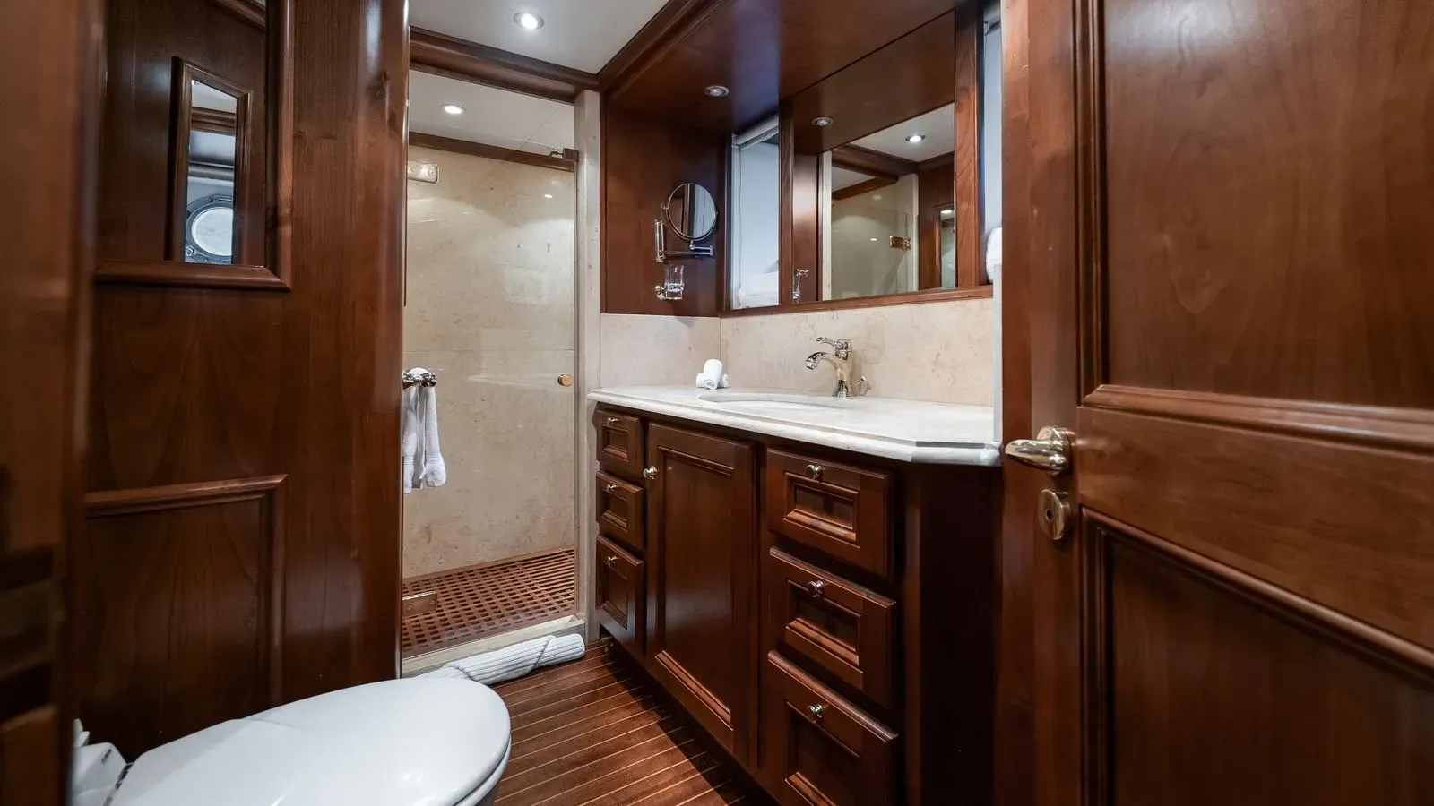En-suite bathroom with shower, vanity and polished woodwork